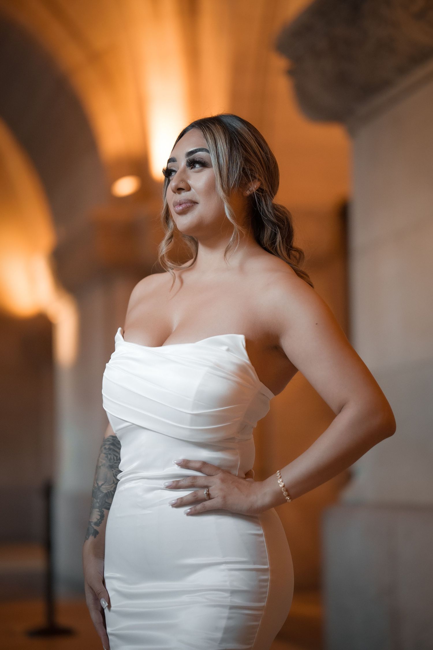 A series of elegant poses in a white wedding dress showing details of the fitted bodice and ruched fabric.