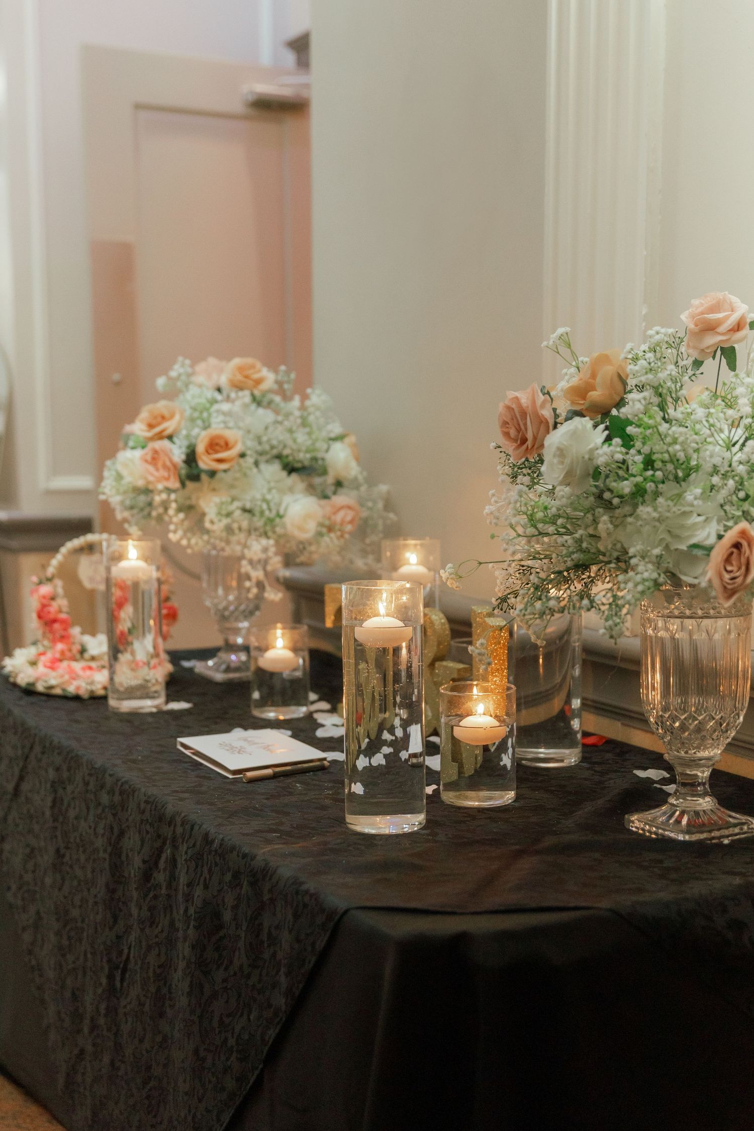 Bride and groom sharing a joyful moment on their wedding day, surrounded by elegant decor and loved ones.