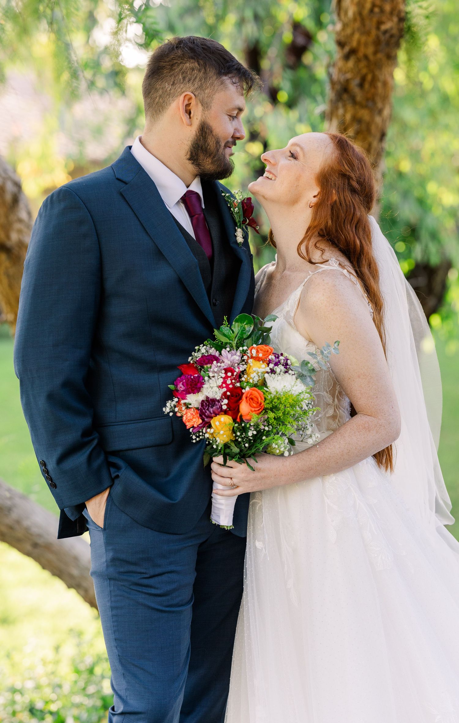Bride and groom looking at each other in San Juan Capistrano