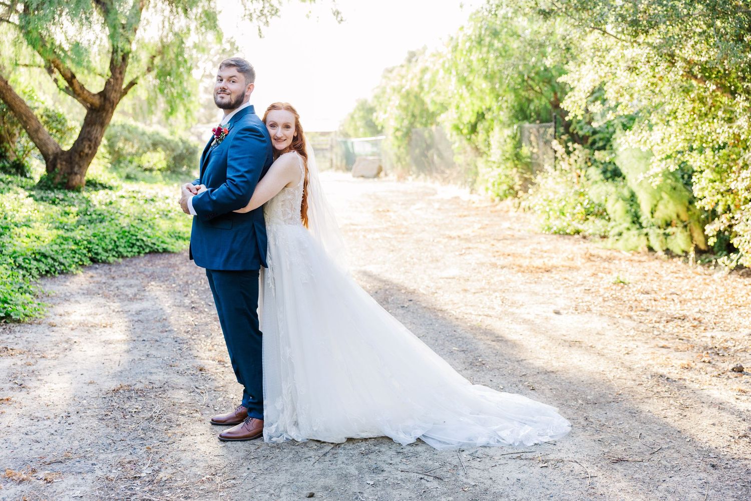 Bride and groom portrait on a trail in San Juan Capistrano