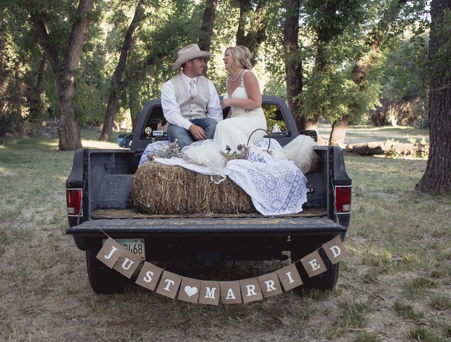 Bride and groom portrait  sitting in a truck in Arizona