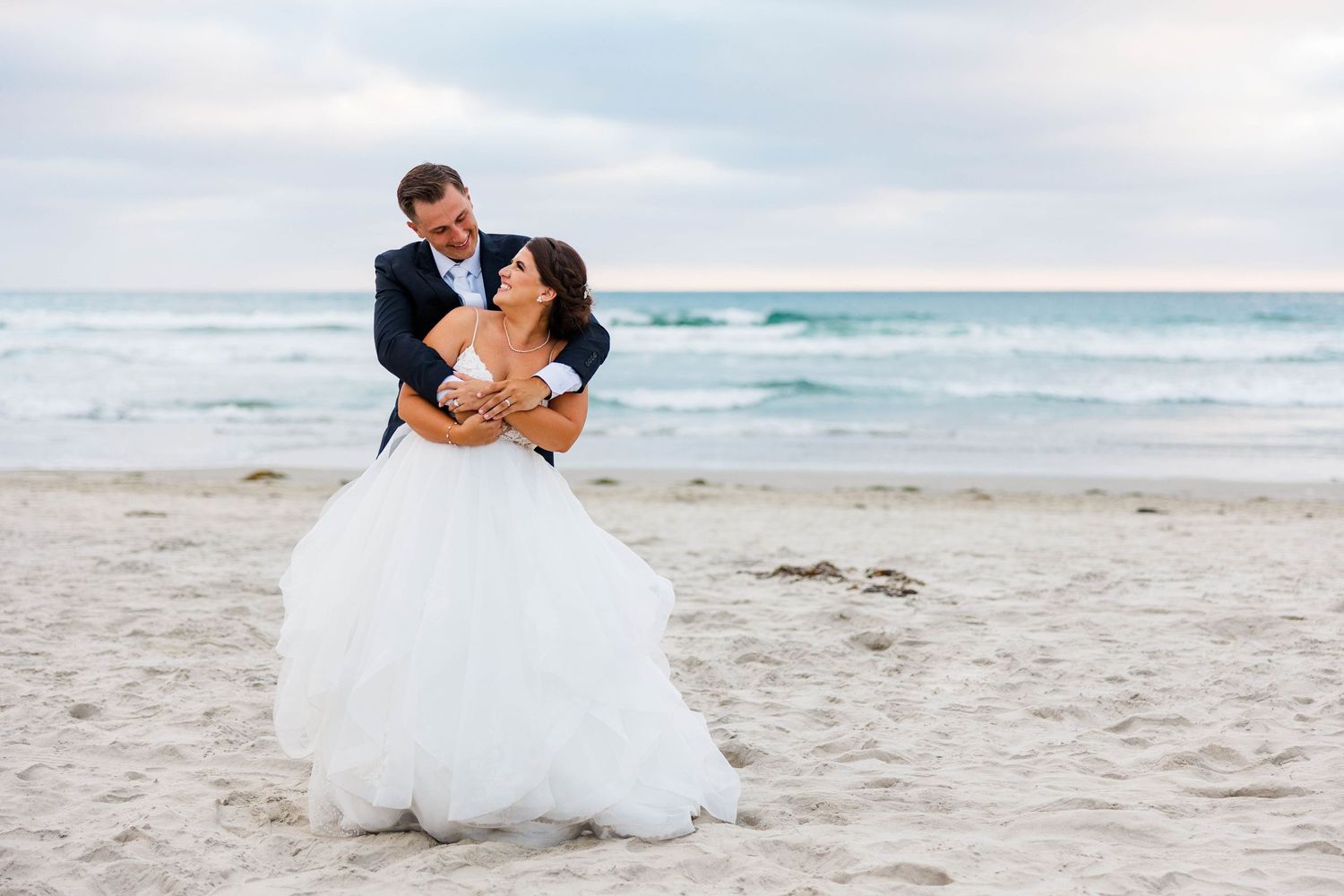 Bride and groom portrait at the beach in Del Mar, California