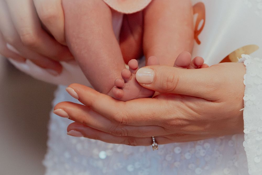 A professional photograph at a hen do celebrating a wedding engagement along with a newborn photoshoot showing a newborns feet