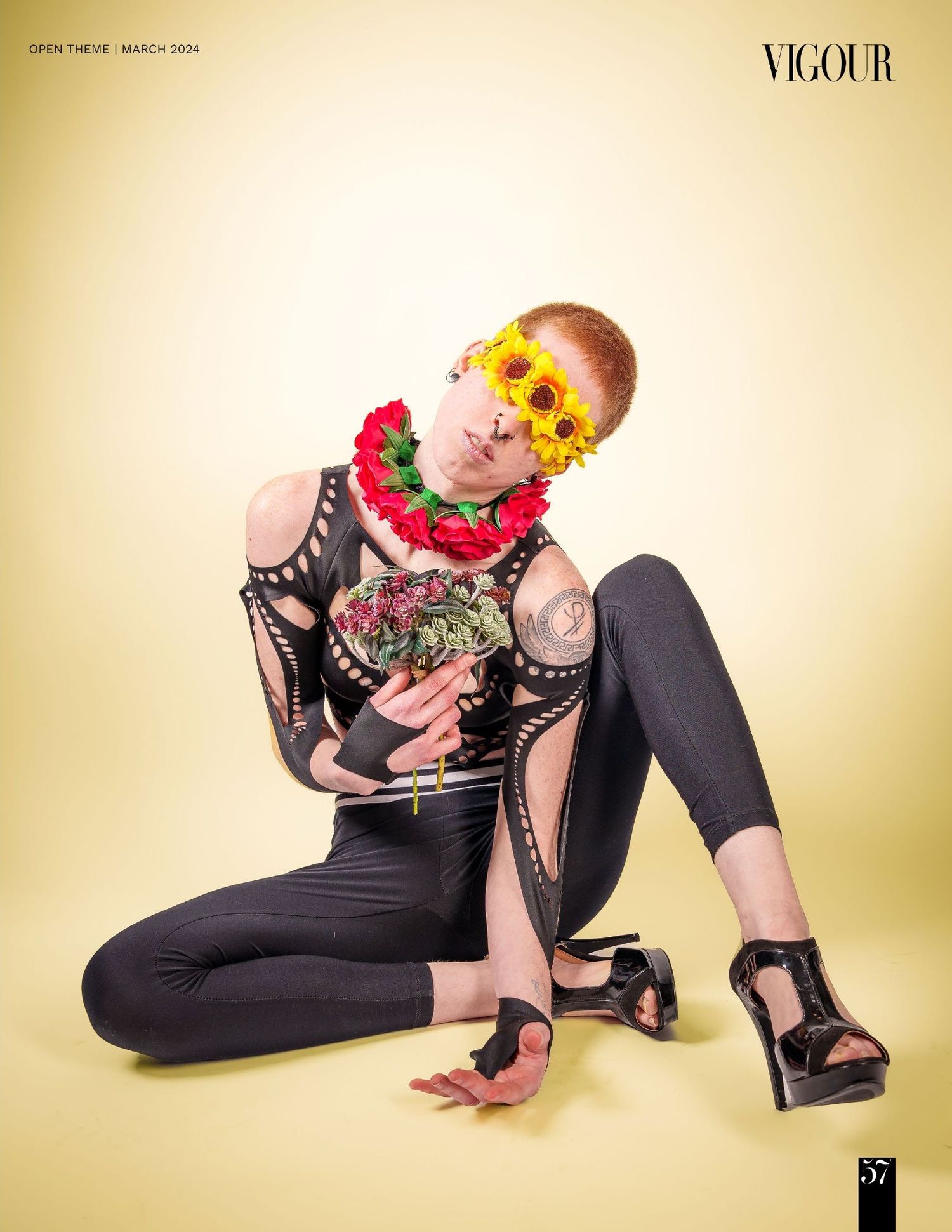 Artistic fashion poses with floral elements against warm yellow studio background.