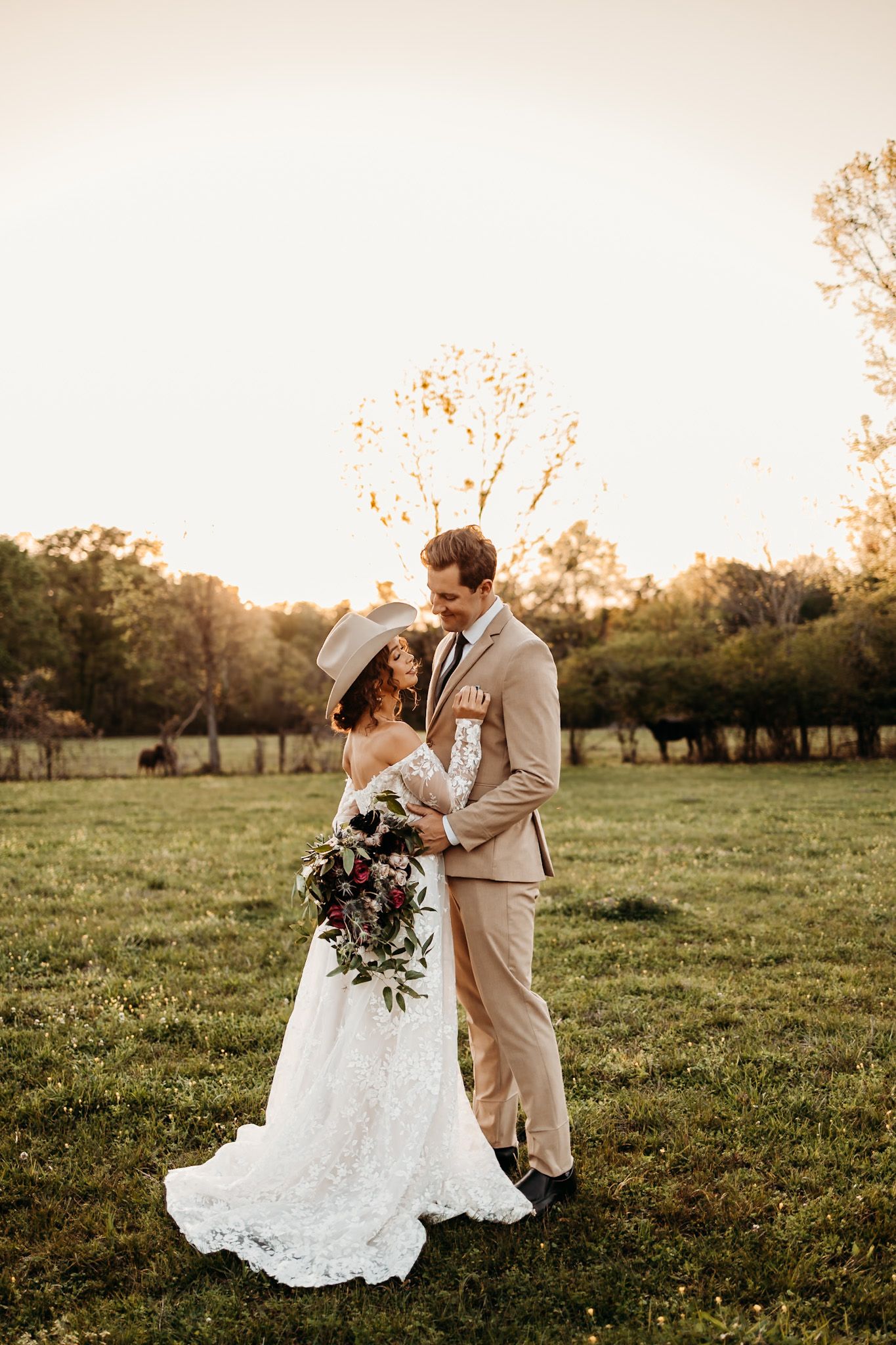 bride and groom at peak sunset gazing at each other