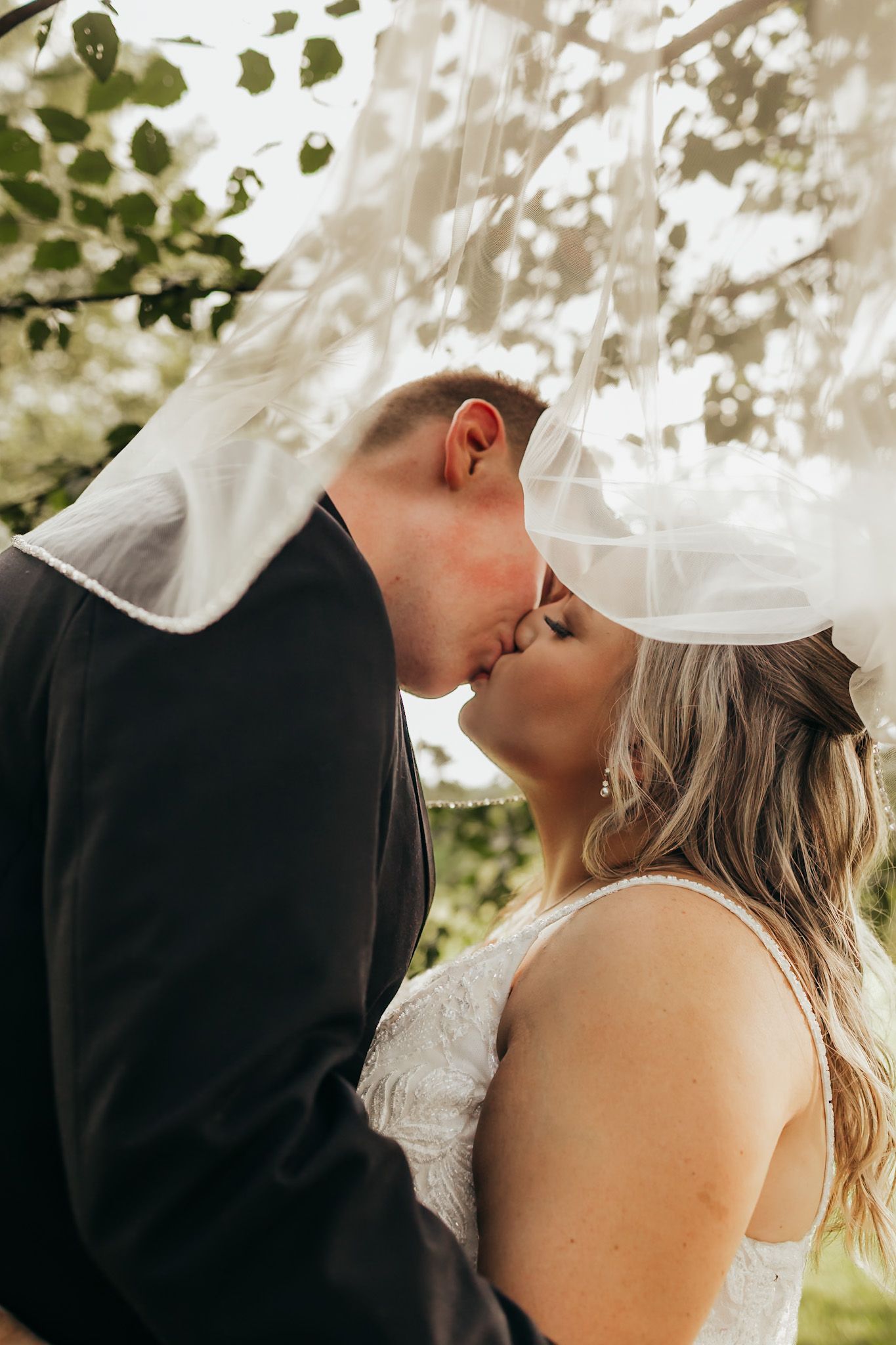 georgia bride and groom under the veil sharing an intimate moment