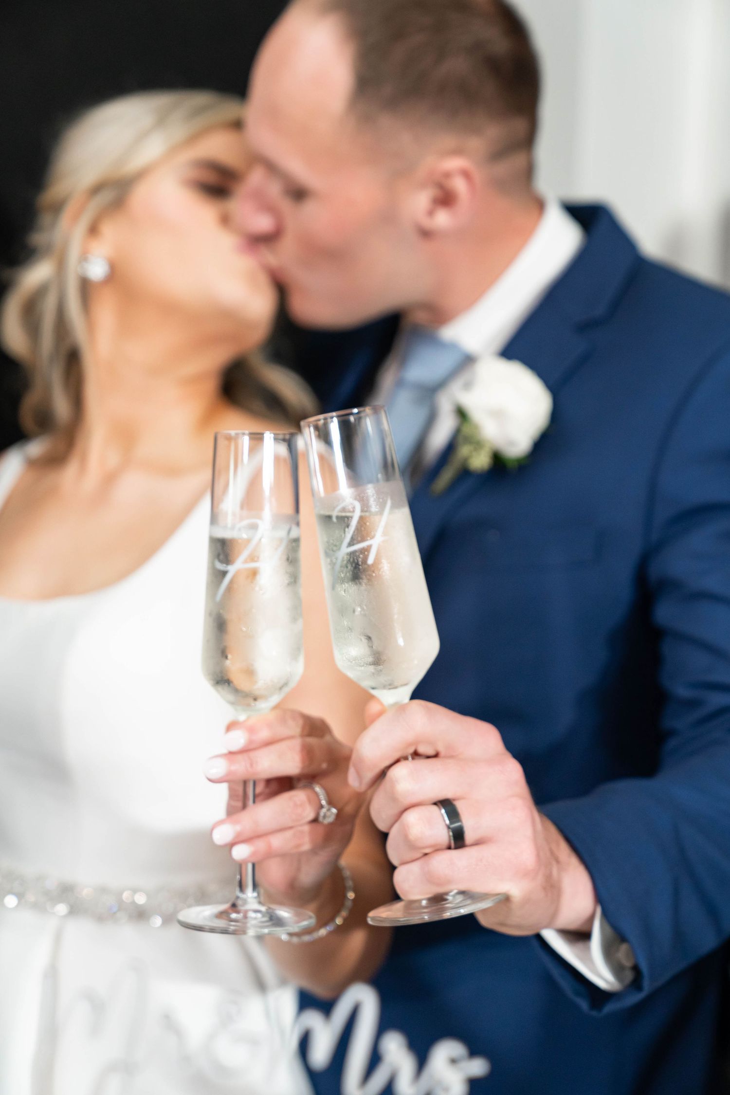 groom and bride kiss