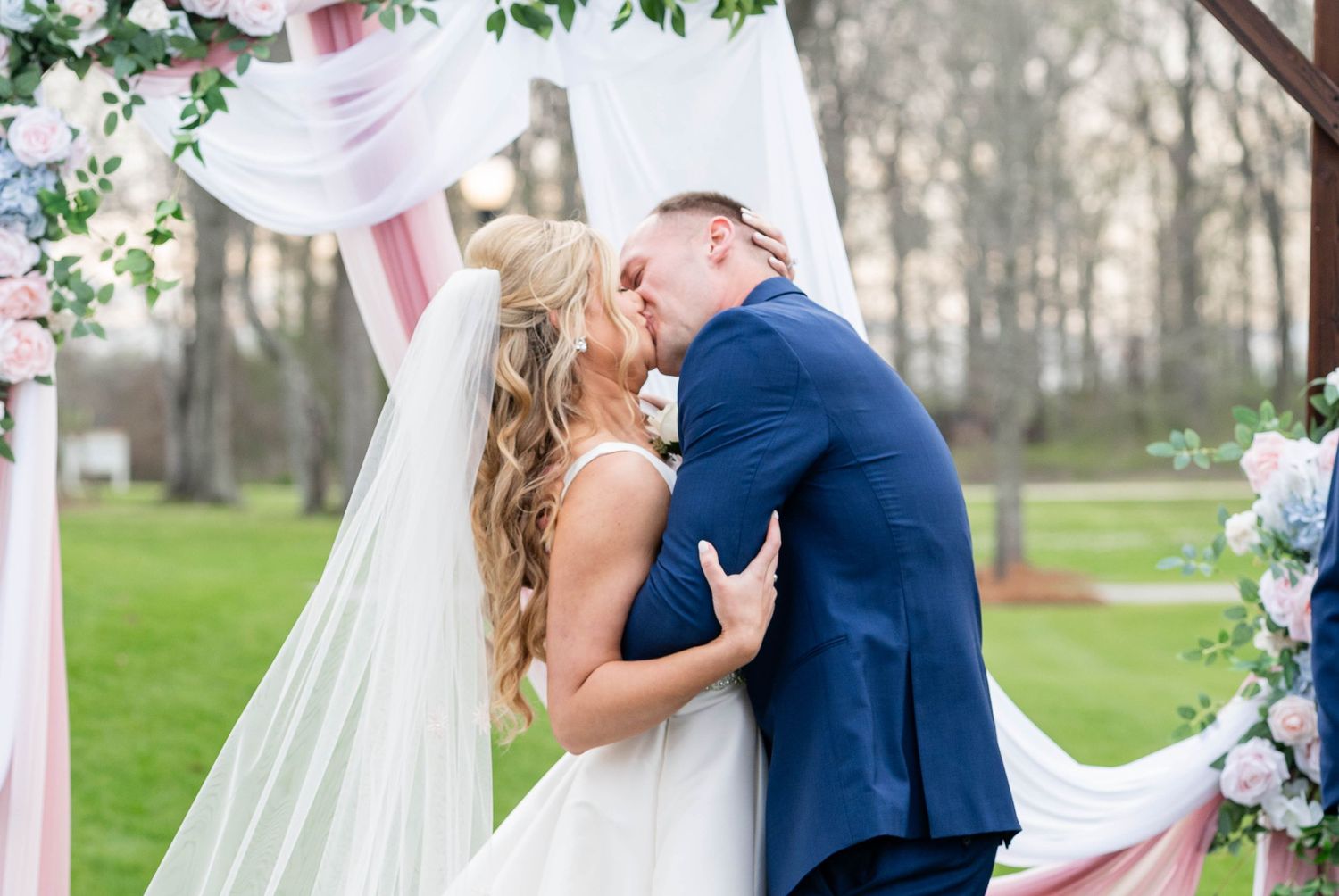 bride and groom kiss