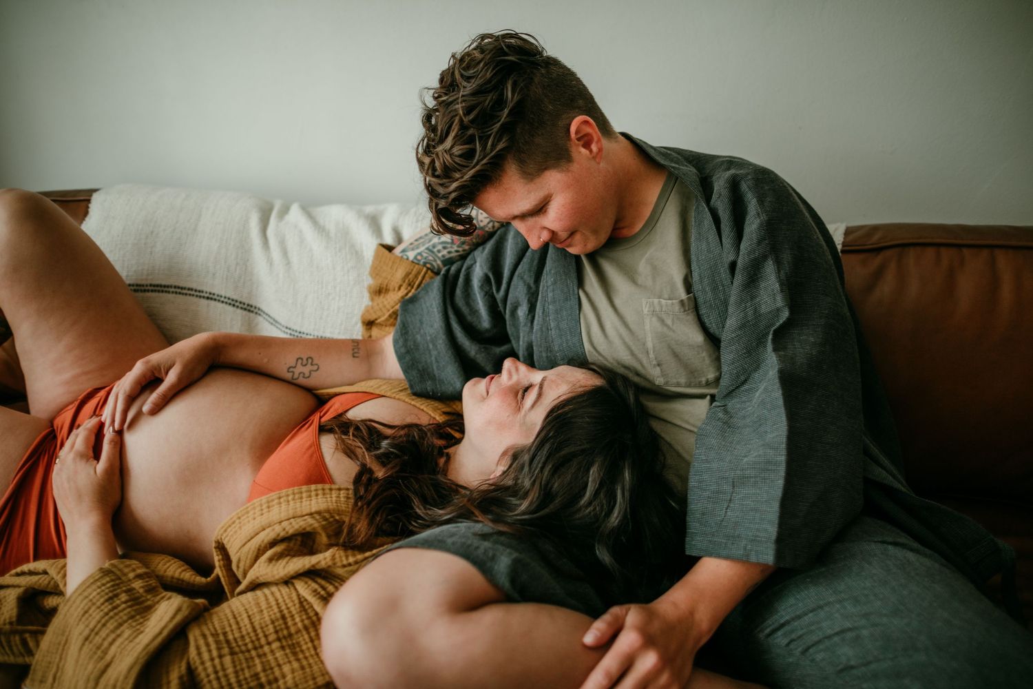 queer couple getting lost in a moment during maternity photography session portland oregon rushes & waves