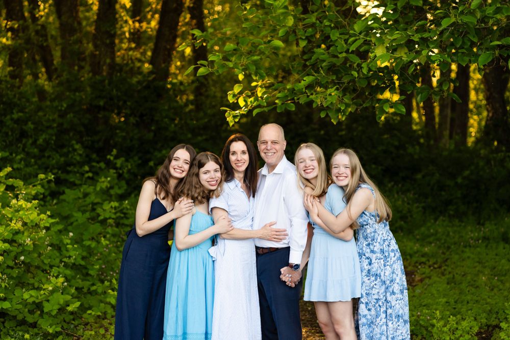 Posed family portrait in a forest in Seattle.