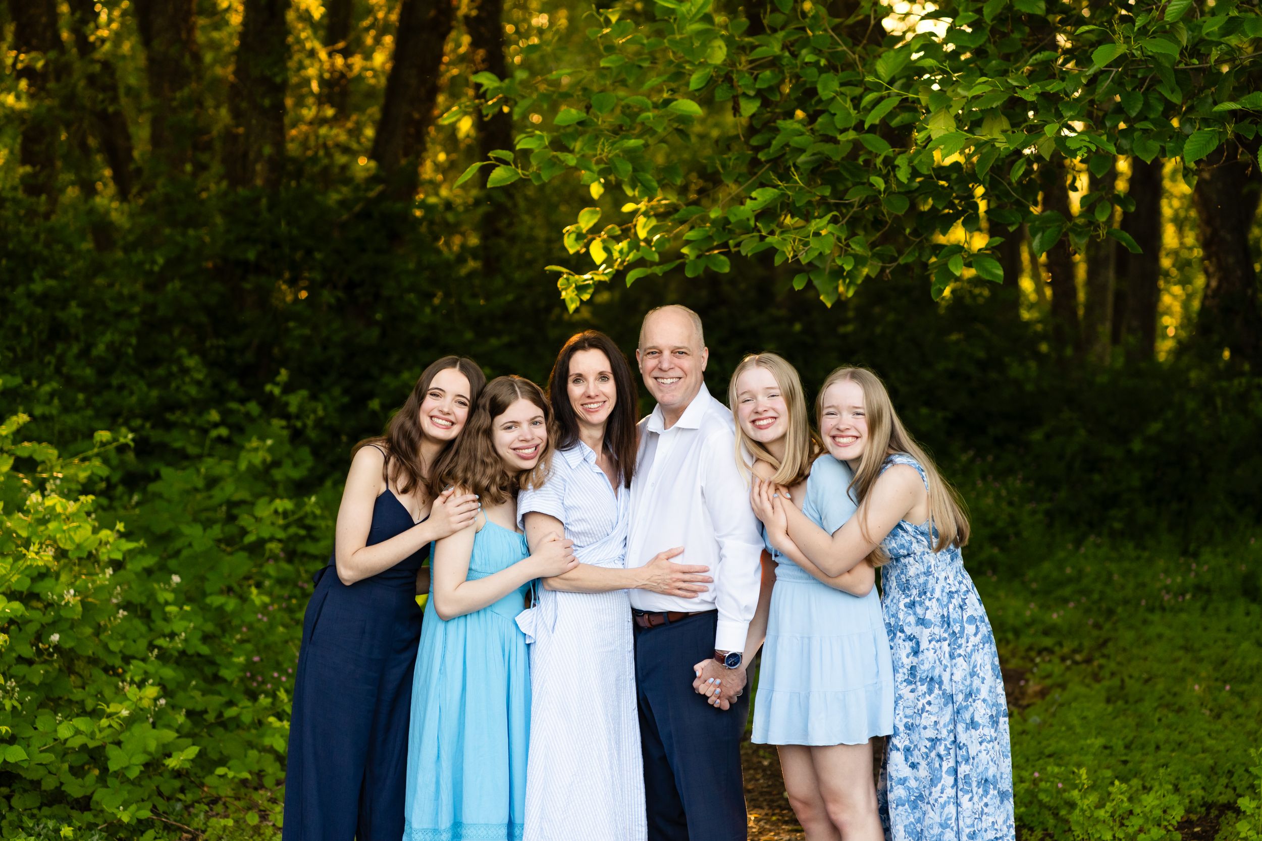 Posed family portrait in a forest in Seattle.