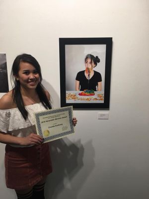 A photo gallery display showing creative food photography with gummy worm art.
