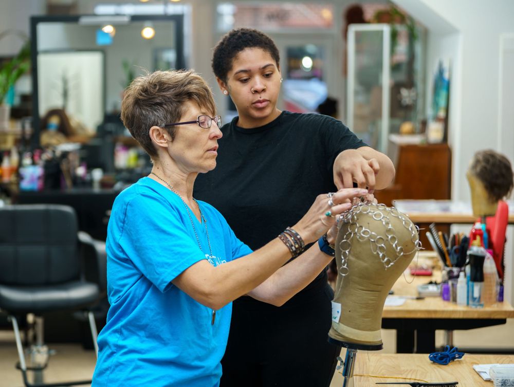 Professional massage therapy session demonstrating bodywork techniques on a neck and shoulder area.