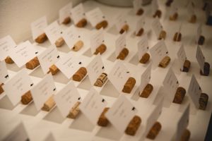 Wedding place cards arranged in neat rows with metallic gold accents.