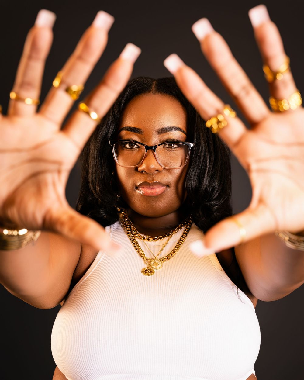 Luxury portrait — hands and gold jewelry detail by Timoy B Photography.