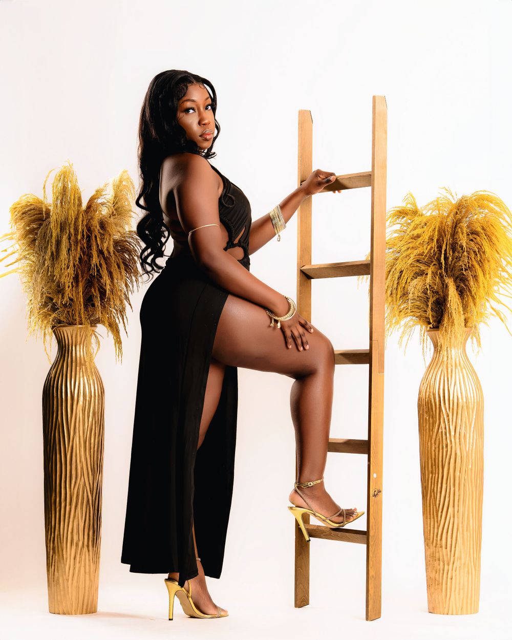 Creative ladder pose — studio fashion session by Timoy B Photography.