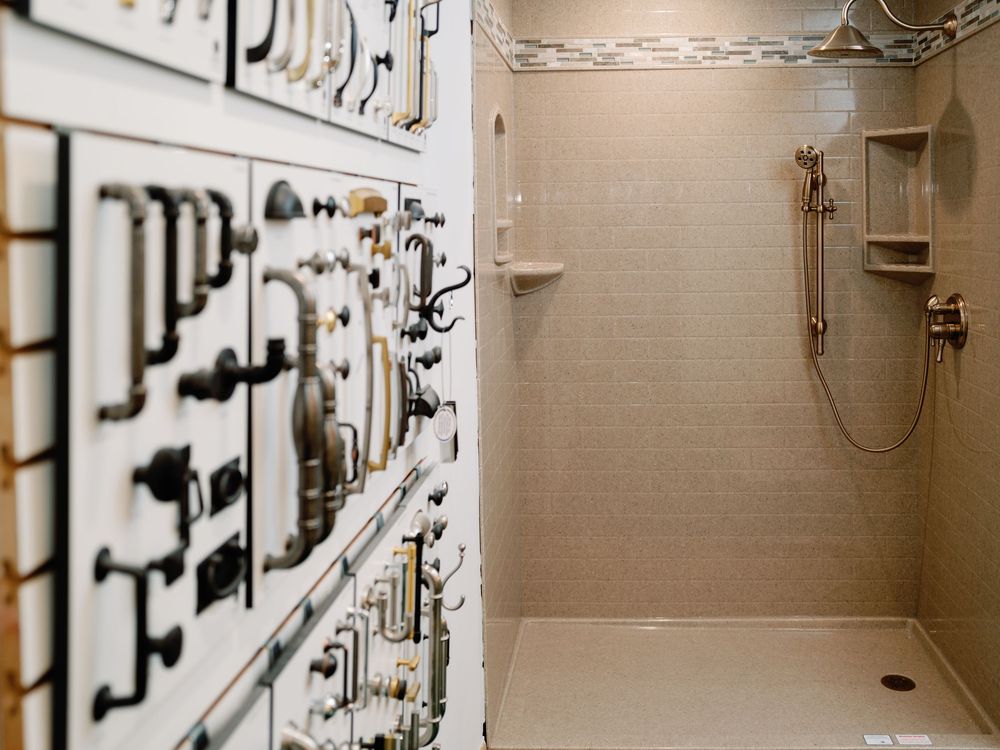 An industrial control panel with metal switches and gauges mounted on a beige wall shows utility equipment settings.