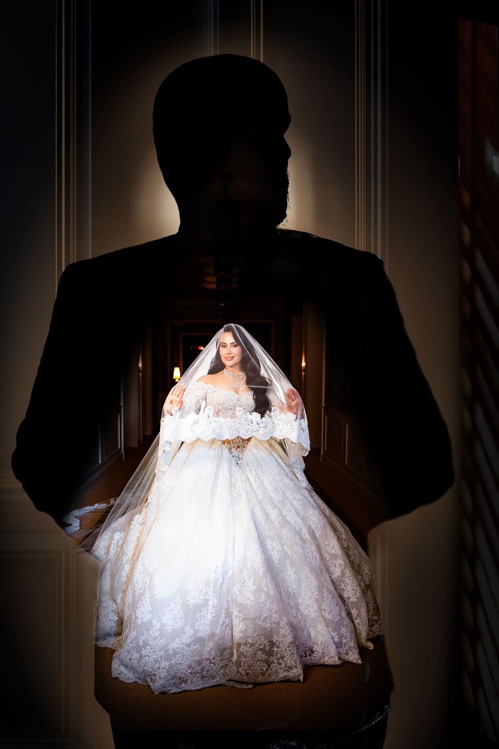 A dramatic silhouette series showing a bride in a white lace wedding dress against dark shadows.