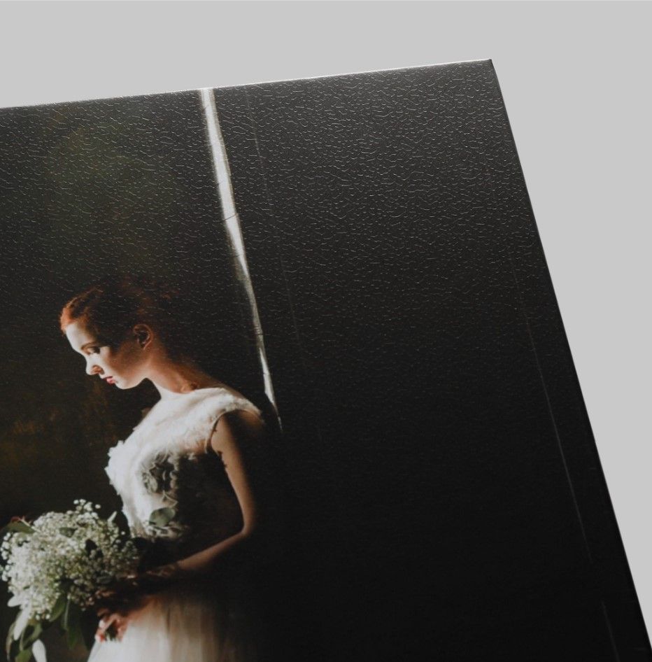"Detailed view of the pebble texture and finish of a professionally printed wedding photo.