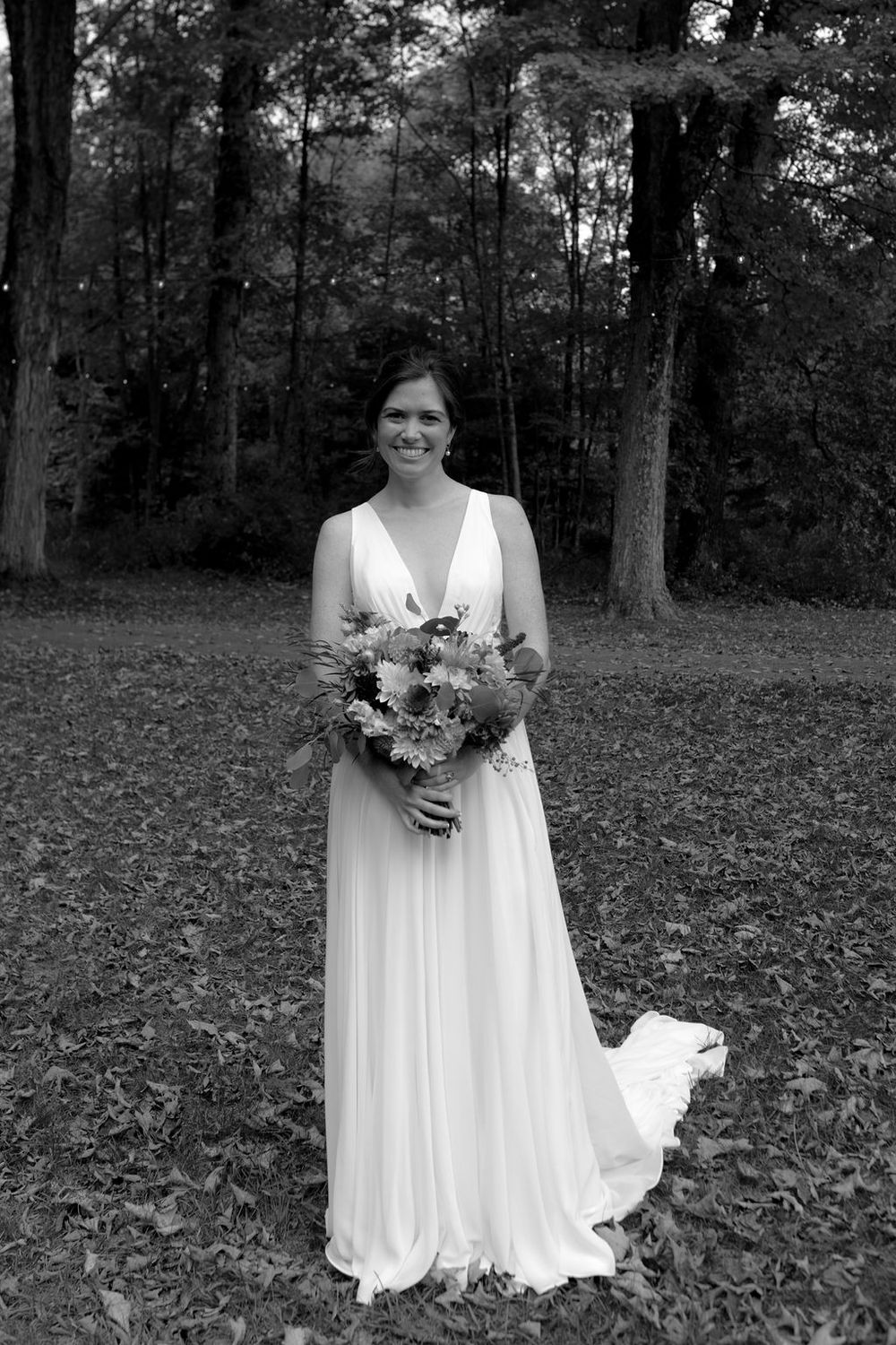 A series of black and white outdoor portraits showing someone in a flowing white wedding dress holding a bouquet.