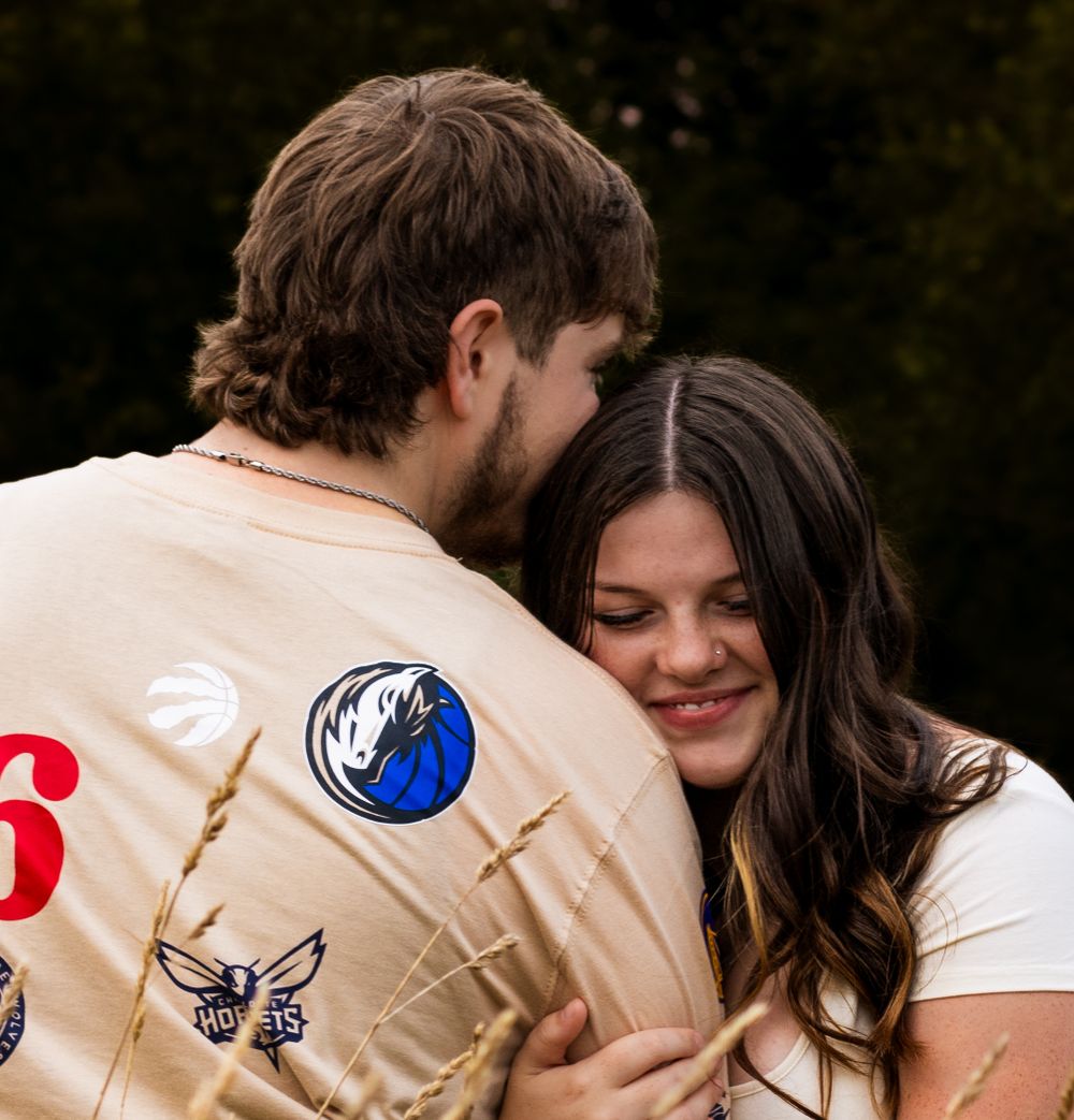Close up of scout uniforms with patches and badges in an outdoor setting.