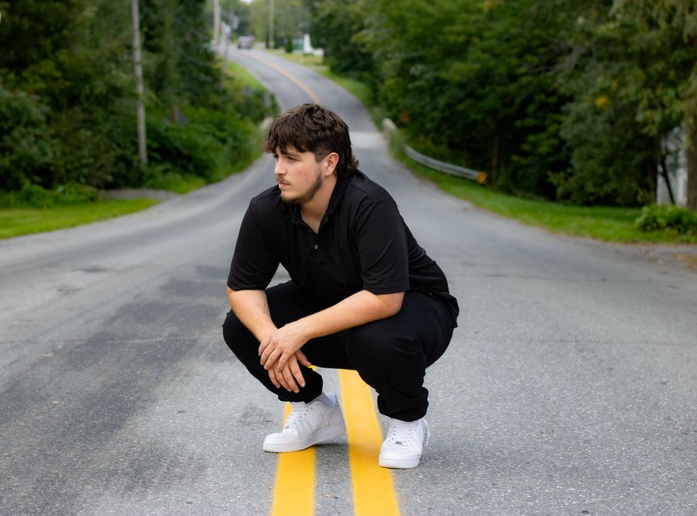 Series of casual poses on a winding country road surrounded by trees.