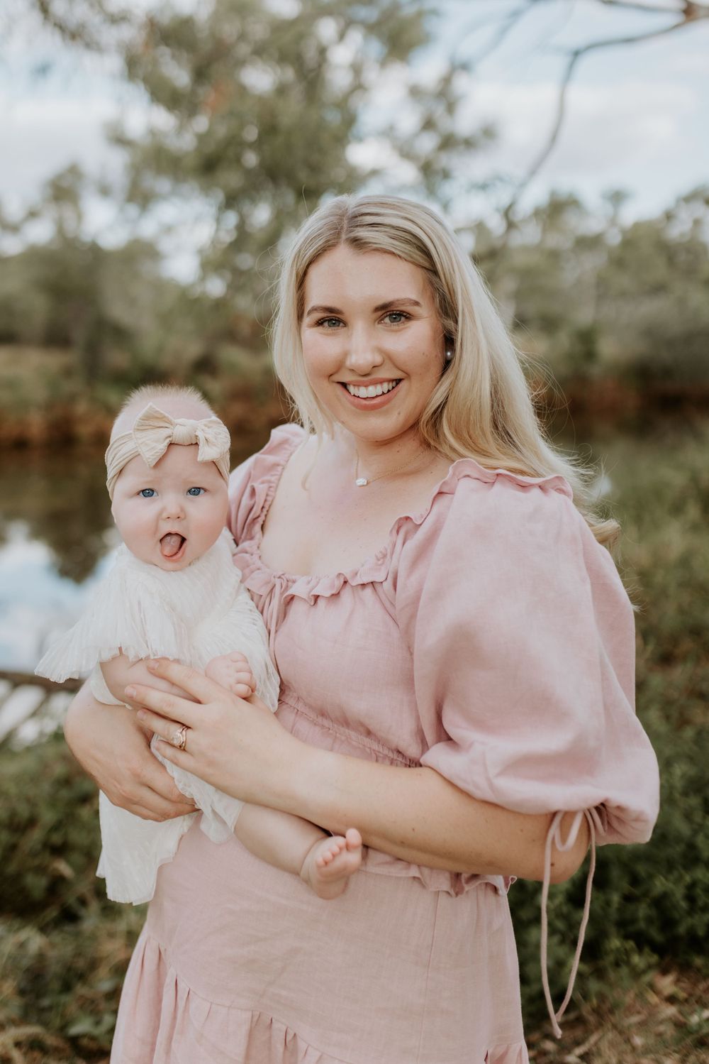 motherhood session in mount isa. mother and daughter pose in from of east leichardt river