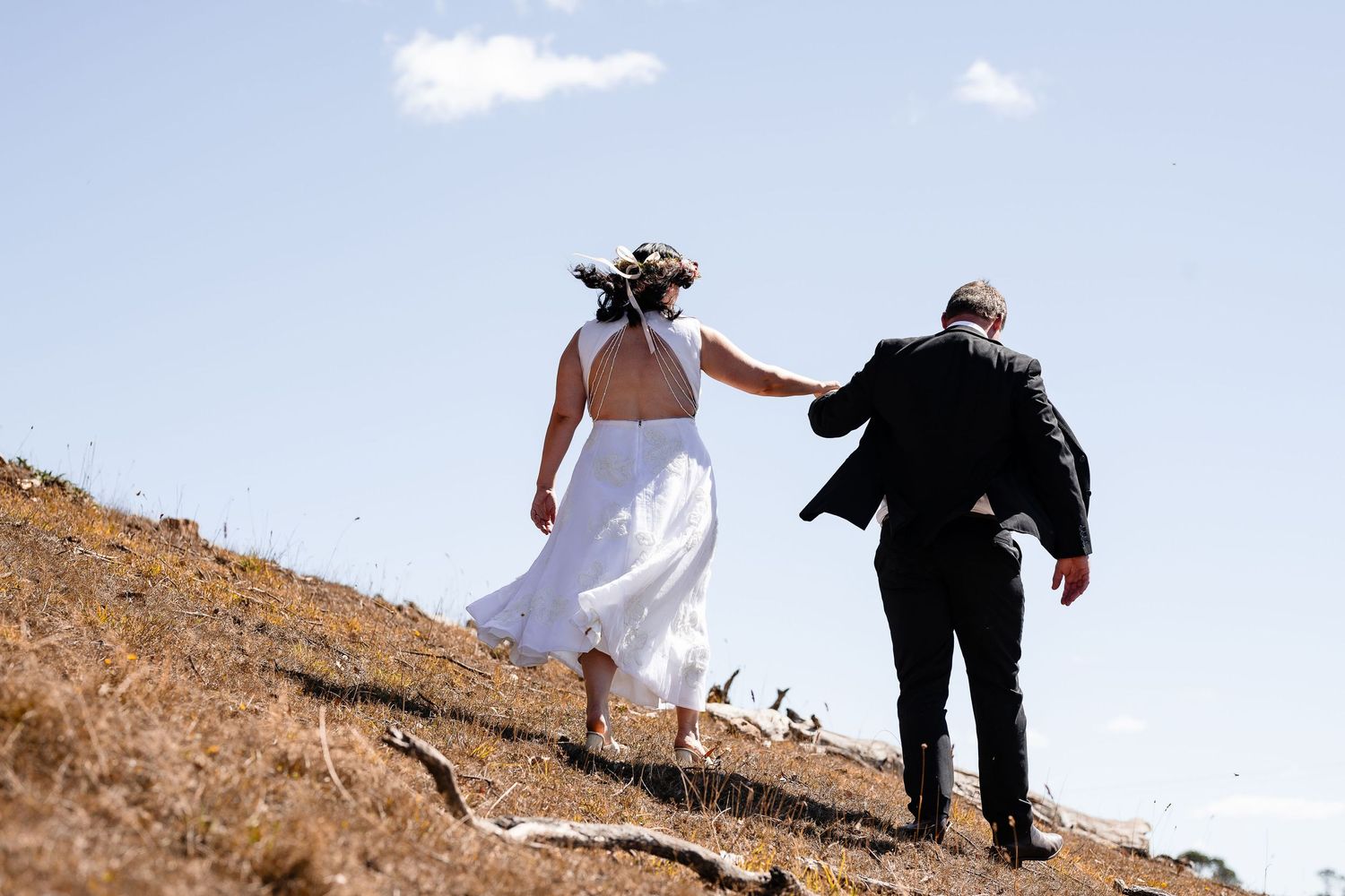 Wedding day jaunt through Tasmanian landscape, expressive documentary capture.