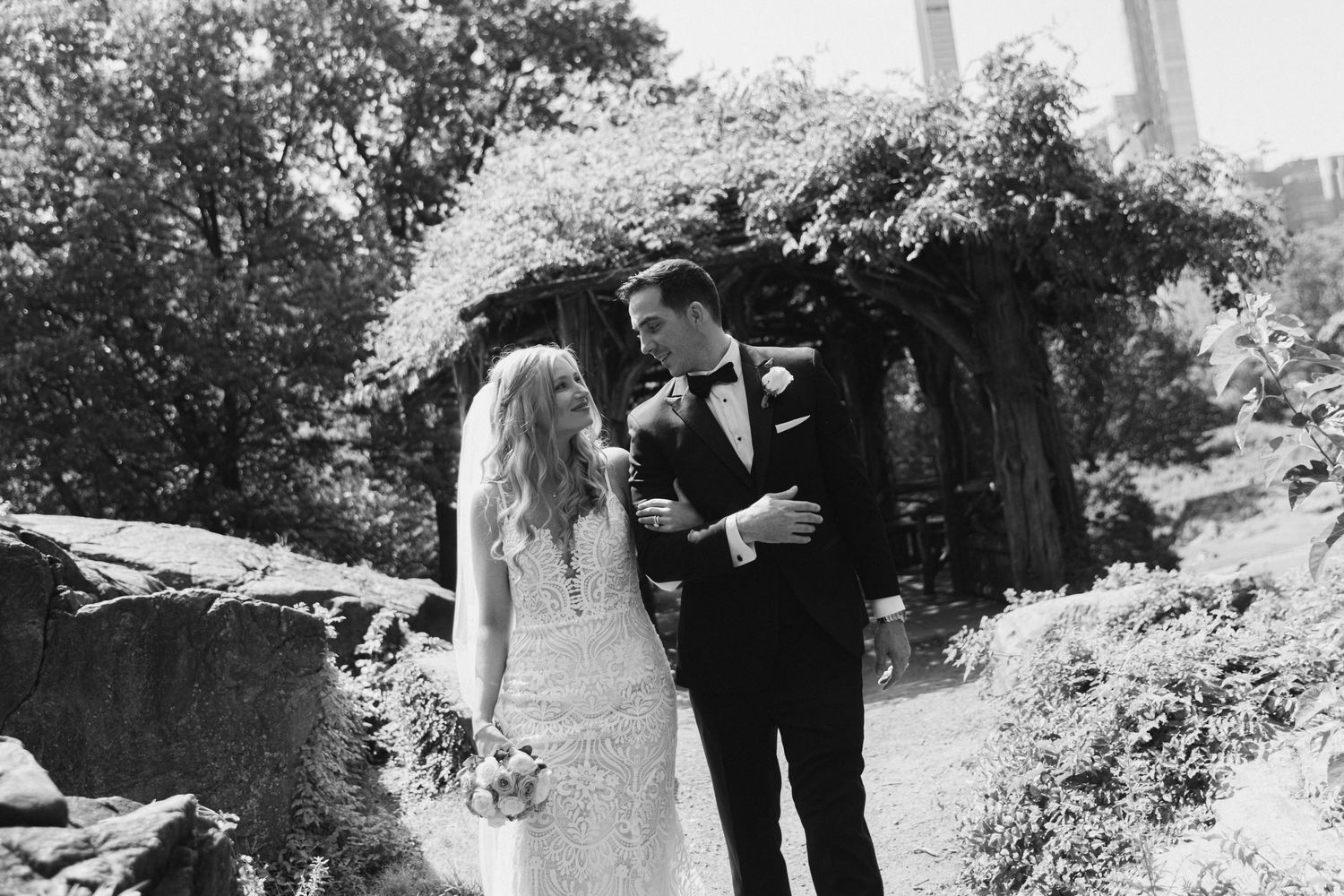 Outdoor wedding ceremony setup with mountain backdrop and floral arrangements.