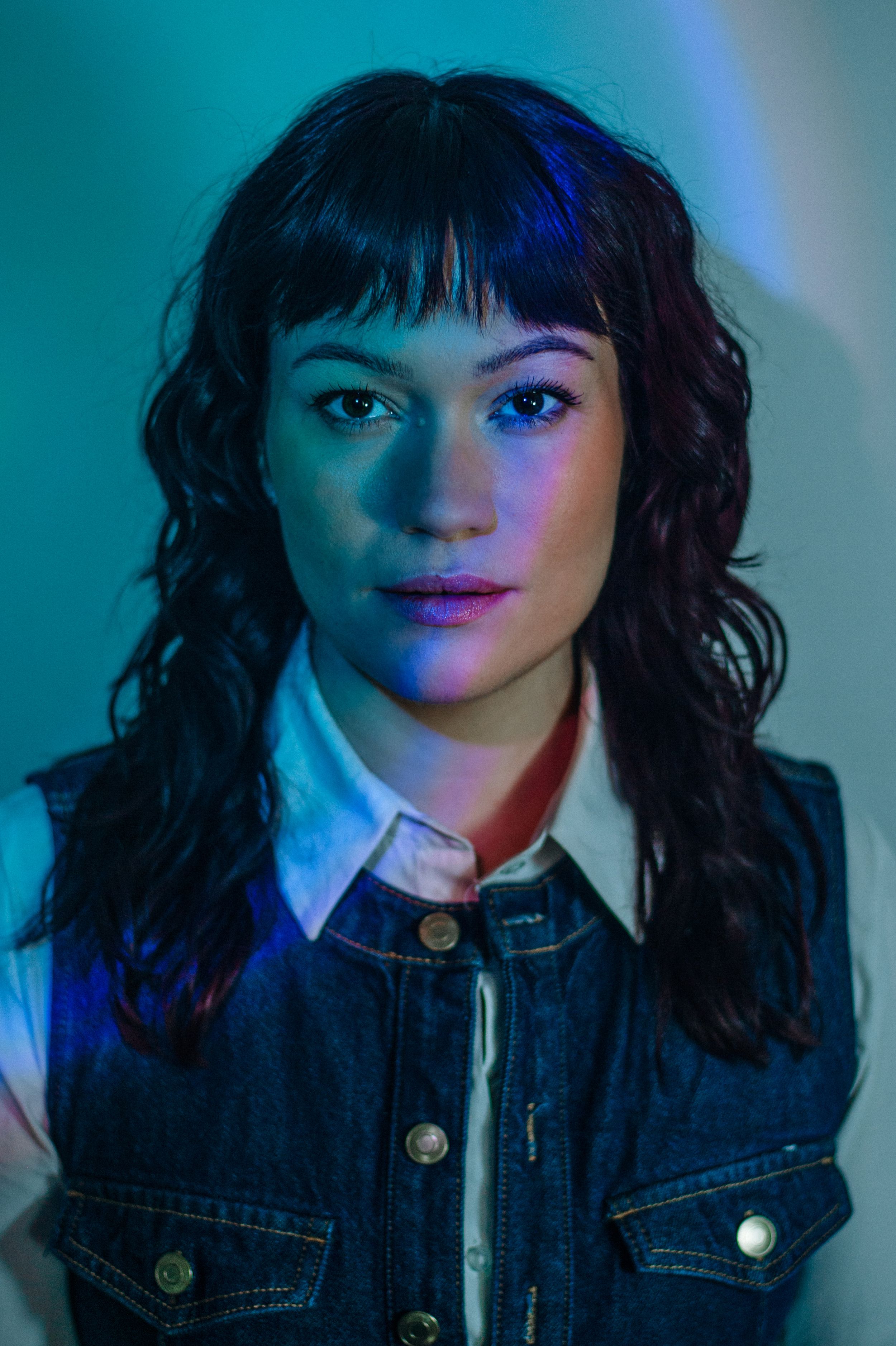 Indoor portrait of a young woman with studio lighting. Actor headshots in Barcelona