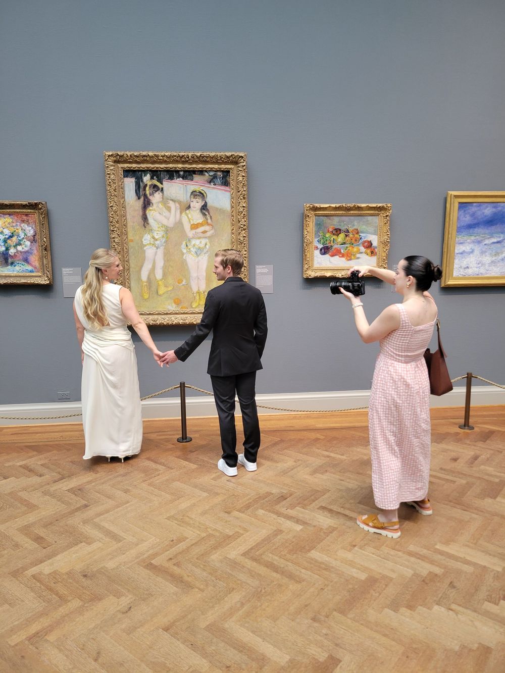 A series of six images showing visitors viewing artwork in a museum gallery with herringbone wood floors and gray walls.