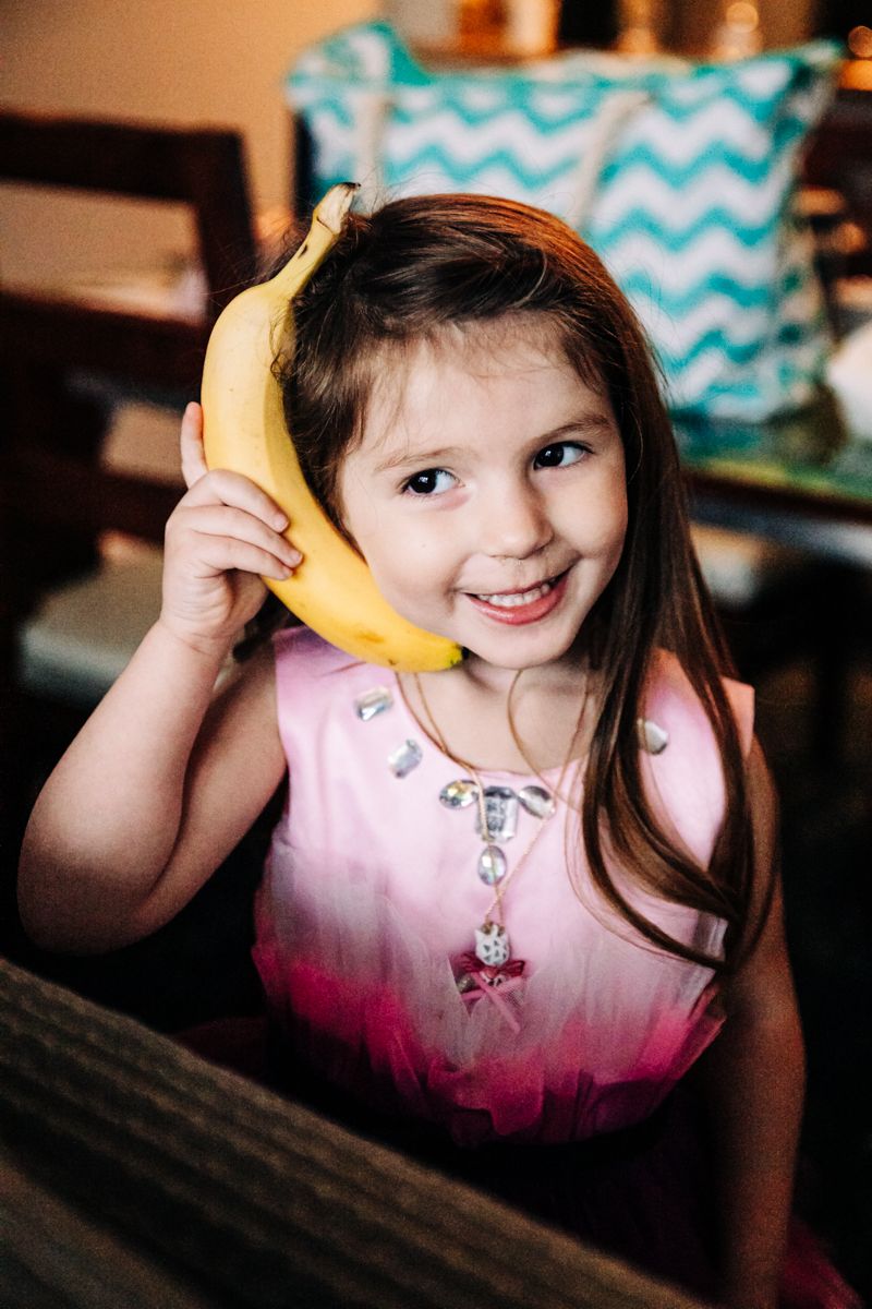 A playful moment with a banana being held up as a pretend phone.