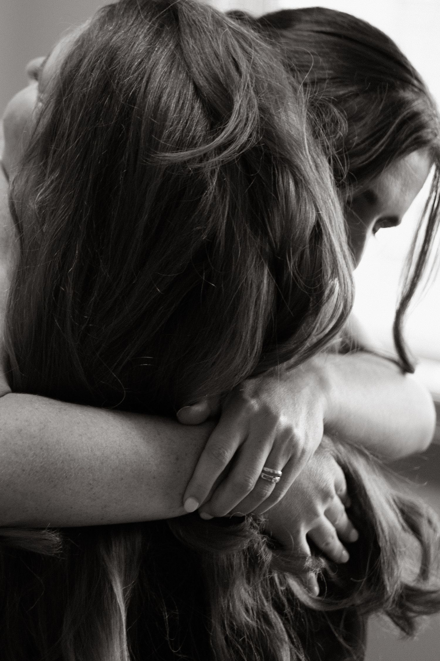 Black and white close-up photo series of two people sharing an intimate kiss.