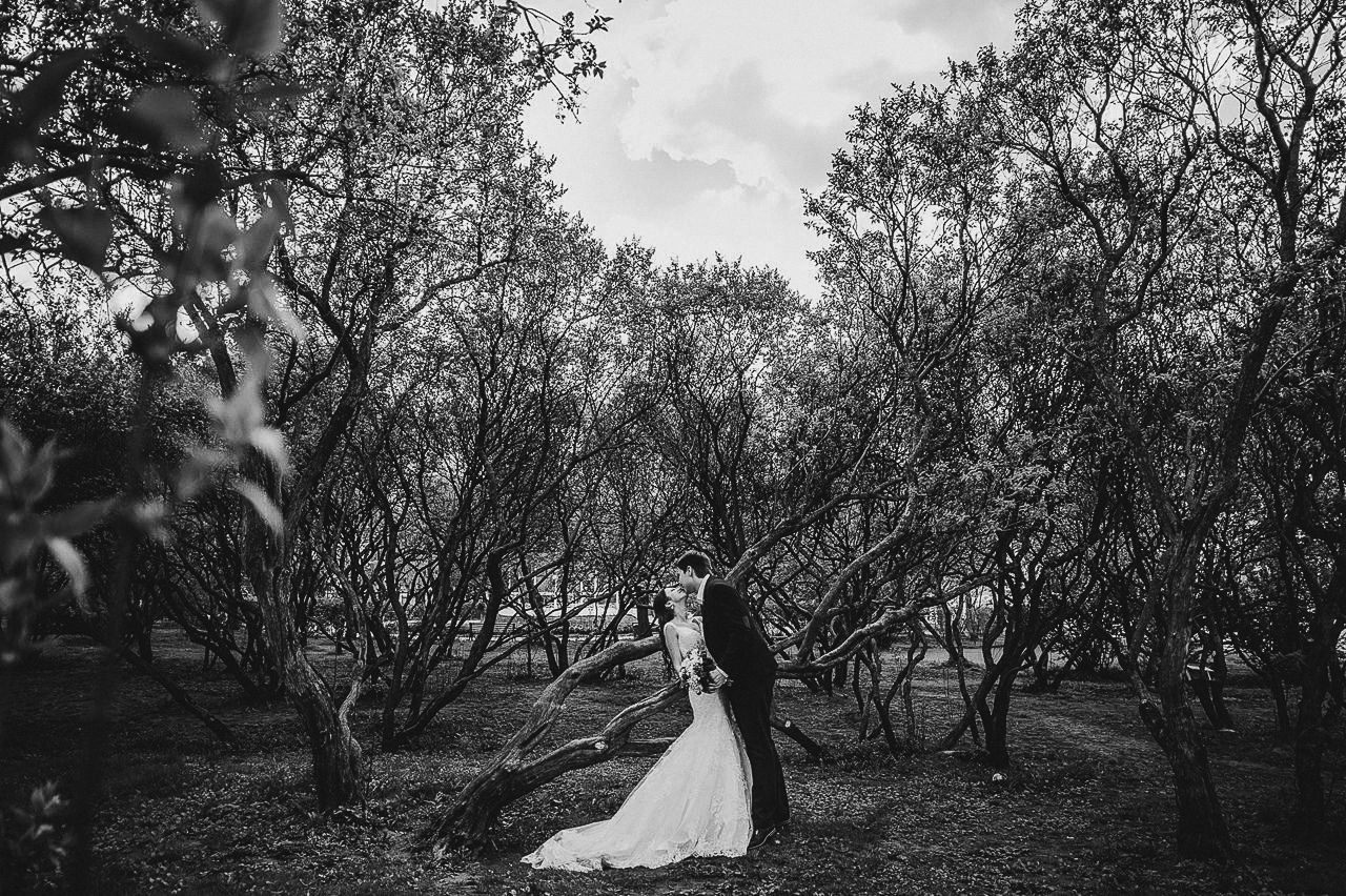 Candid photo of the couple laughing at their outdoor ceremony