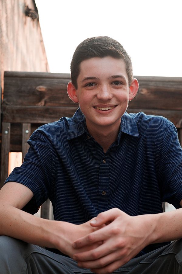 High school senior smiling casually during natural light outdoor senior session in Tri-Cities WA