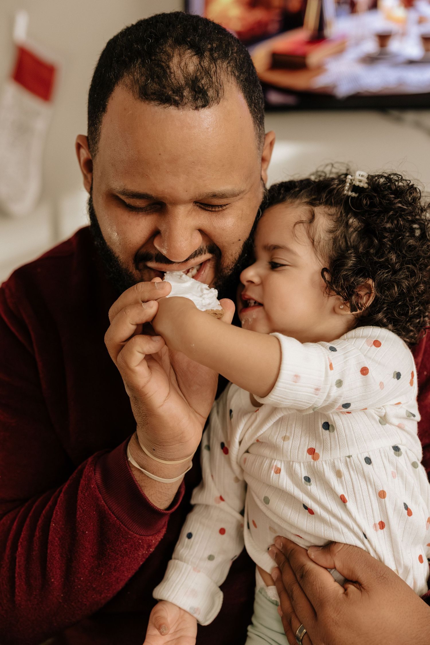 A heartwarming sequence of candid moments between a parent and child sharing laughter and affection.