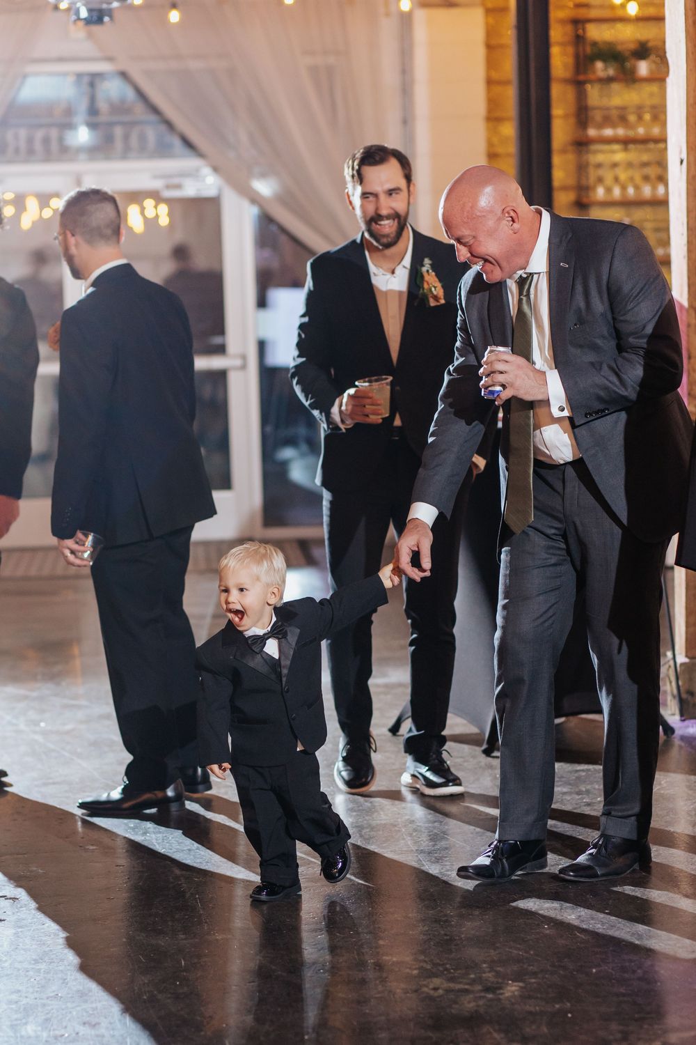 Wedding reception dance floor scene with guests enjoying the celebration.