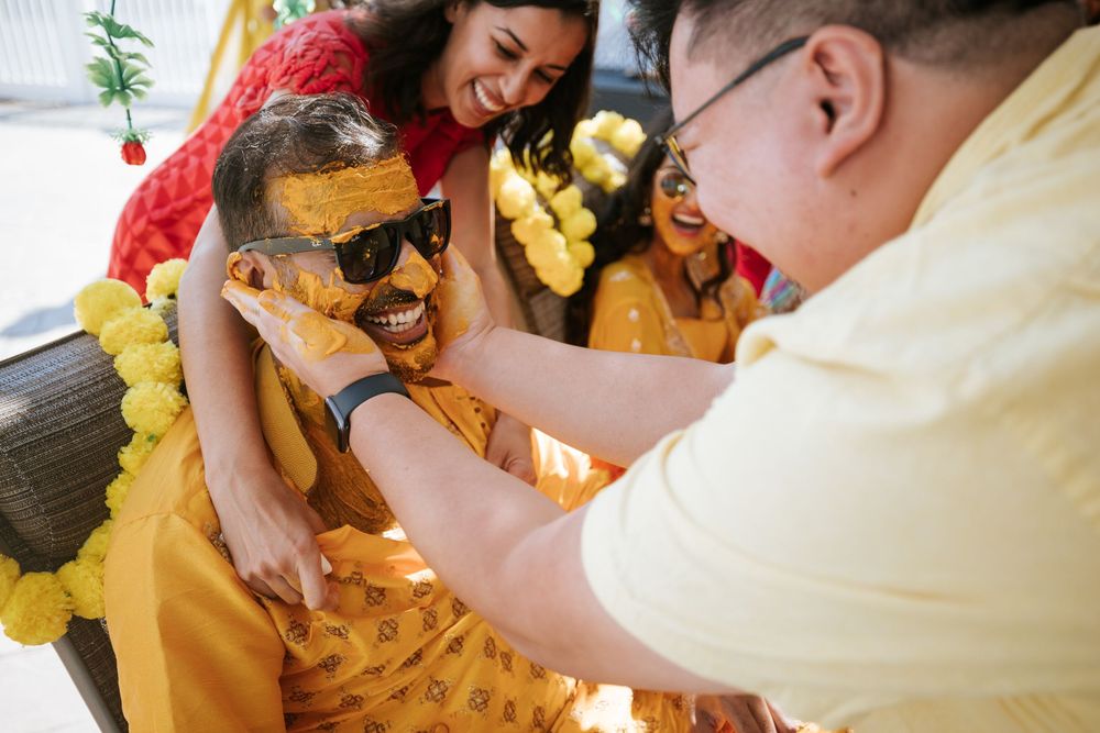 Medical professionals in yellow protective gear work together during an emergency response situation.