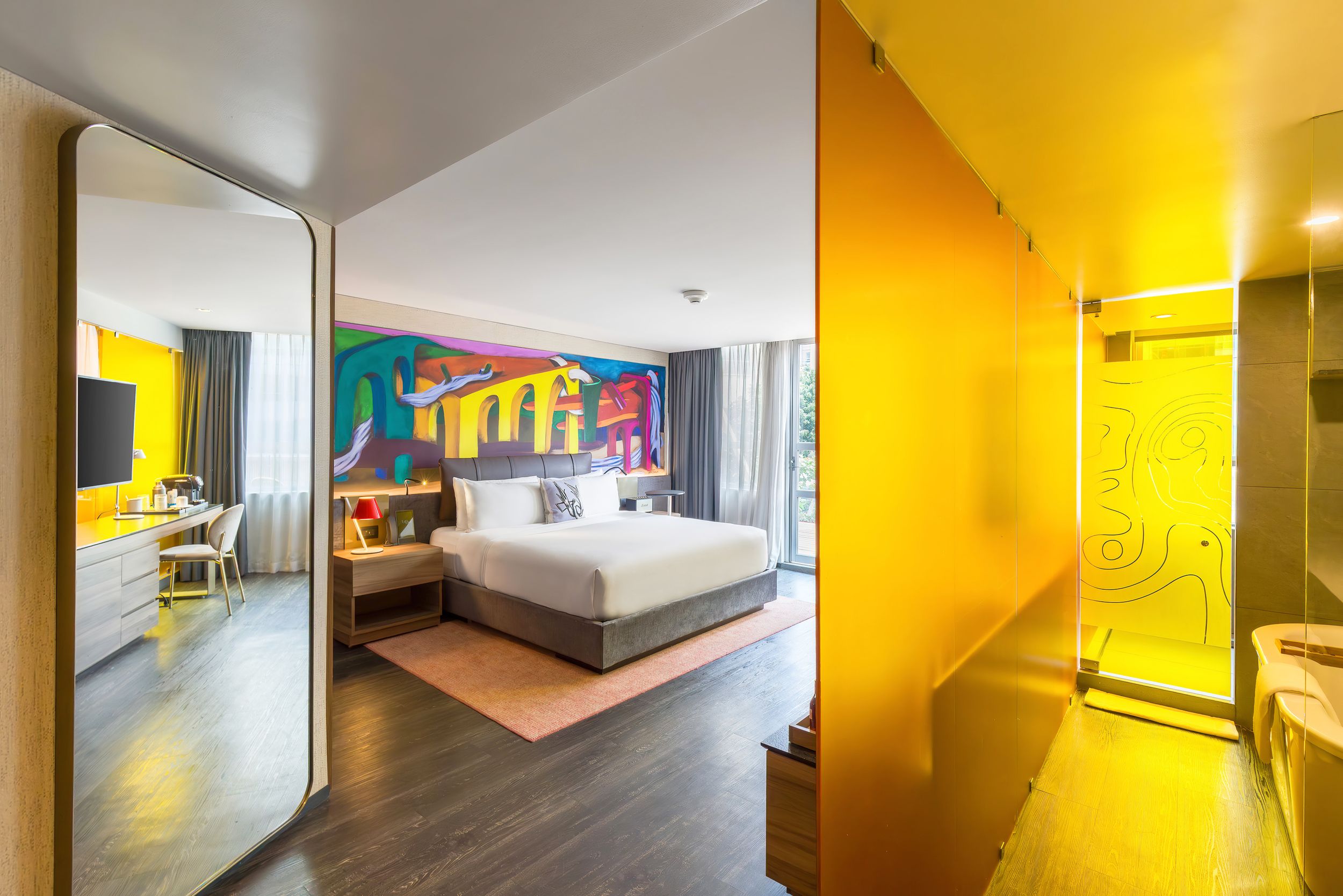 Modern minimalist apartment interior with yellow accent walls features sleek design elements and clean lines throughout.