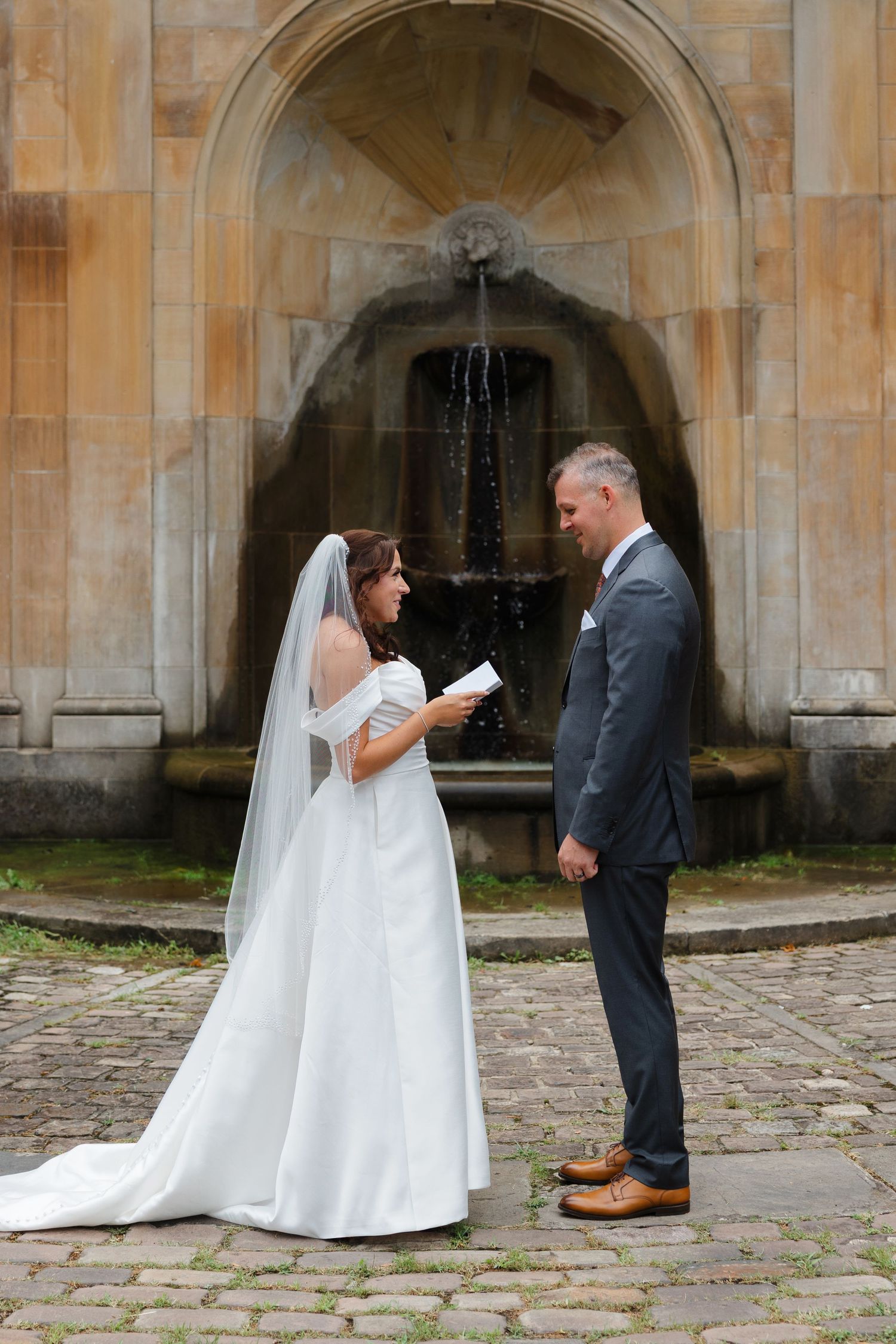 Bride and groom exchanging vows at Italian Cultural Gardens in Cleveland, Ohio.