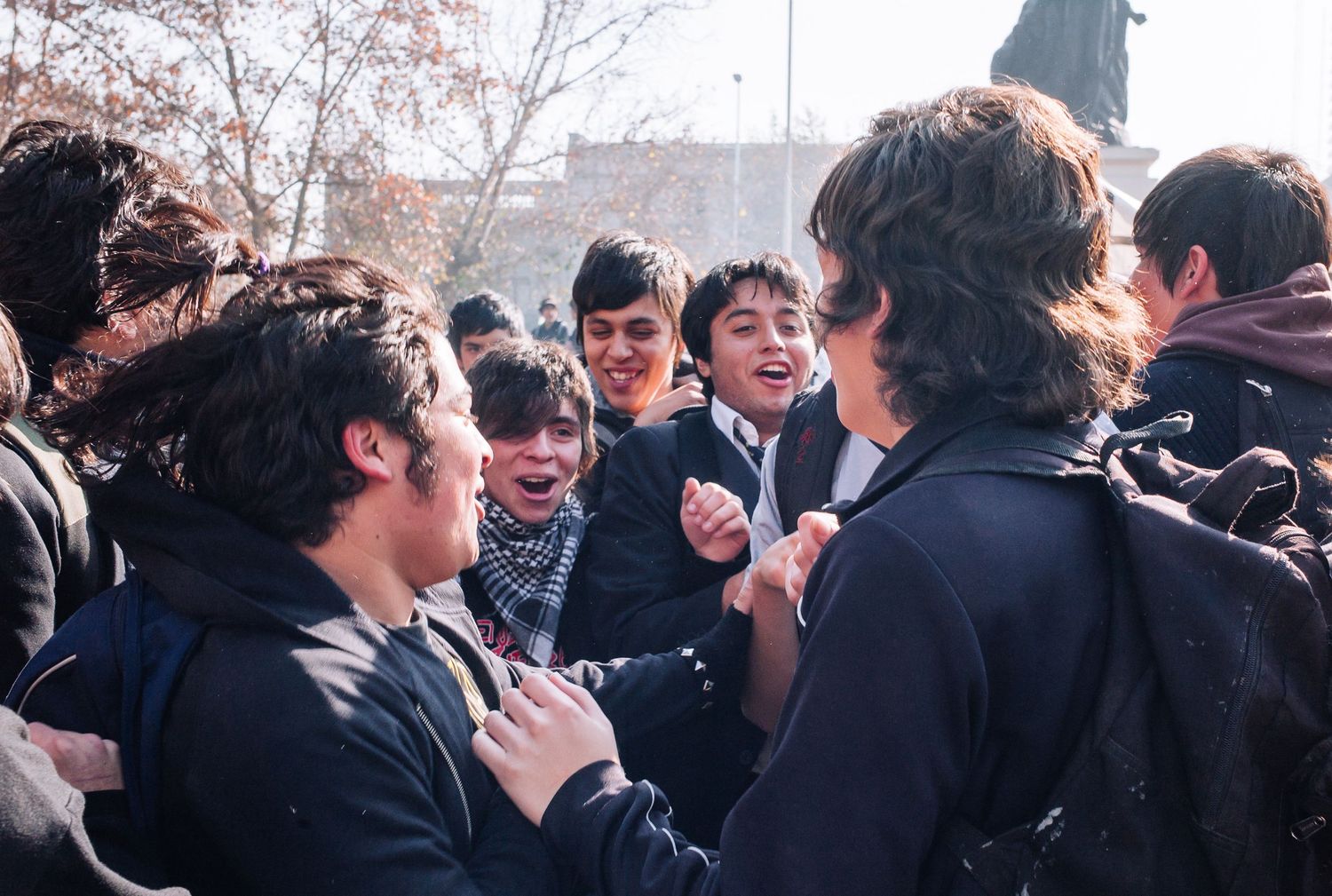Crowd of  students celebrating in the street during a street demonstration for a fairer education system. Santiago, Chile