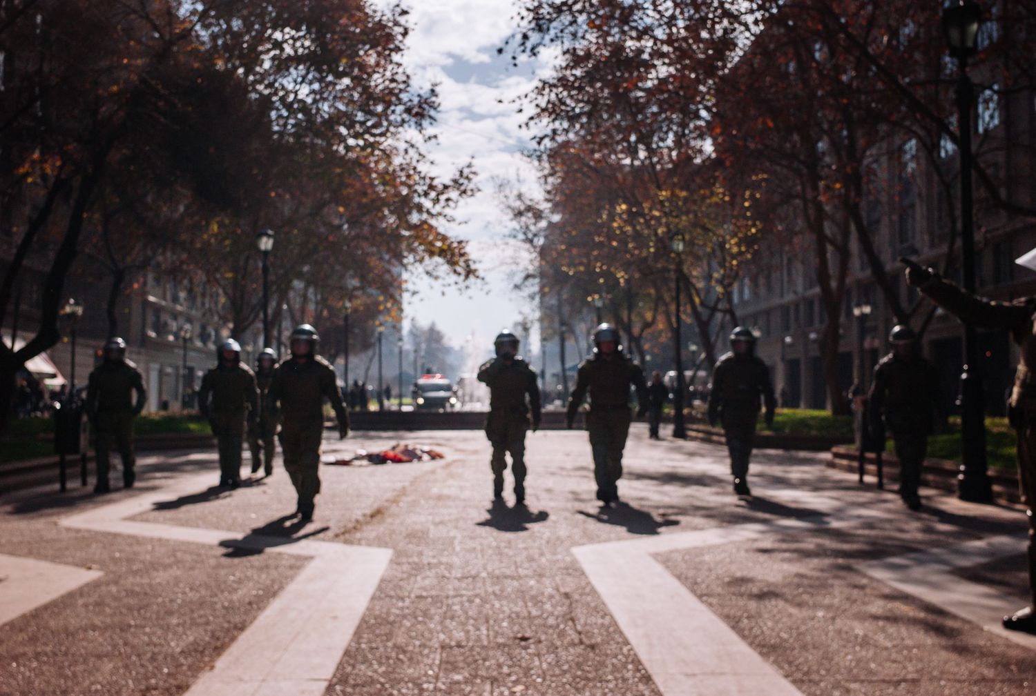 Riot police approaching to break up a crowd, during a street demonstration for a fairer education system. Santiago, Chile