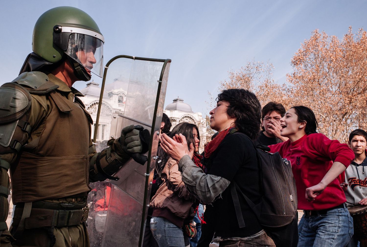 Interaction between protesters and riot police during a street demonstration for a fairer education system. Santiago, Chile