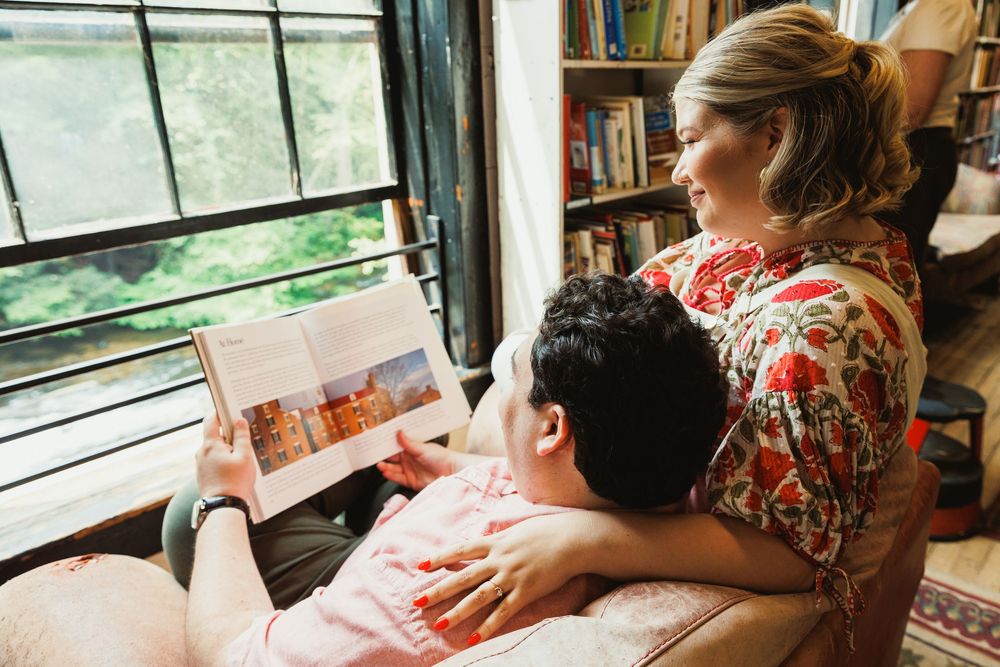 Cozy reading session by a window in a bookstore.