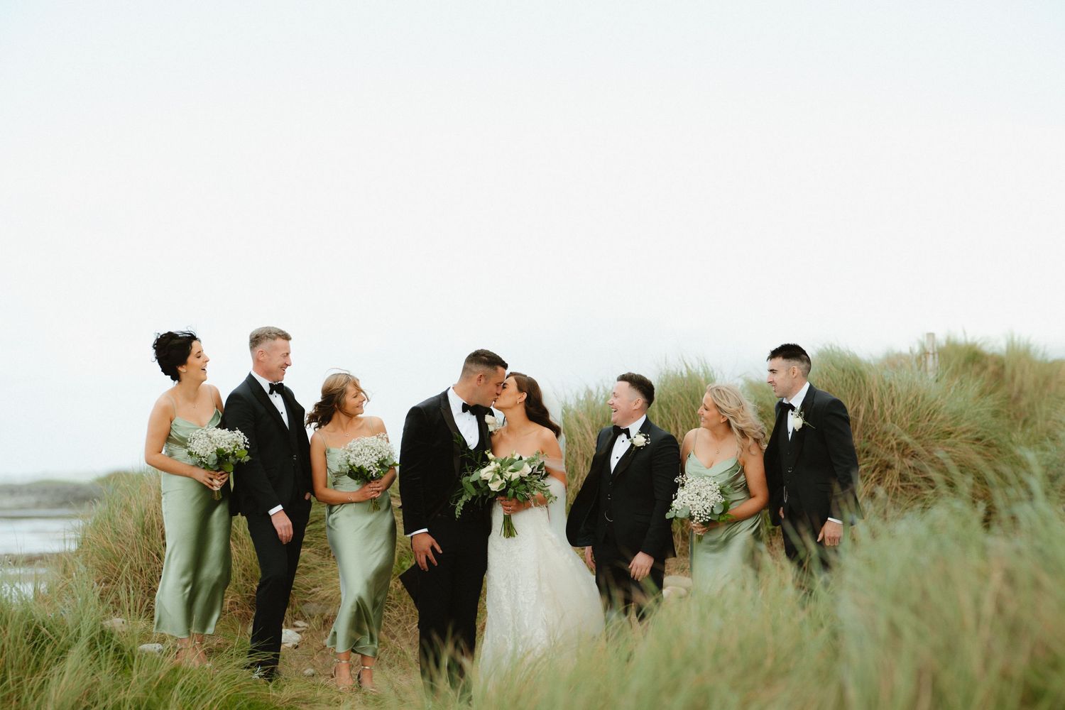 Bride and groom with bridal party on beach in Co. Sligo