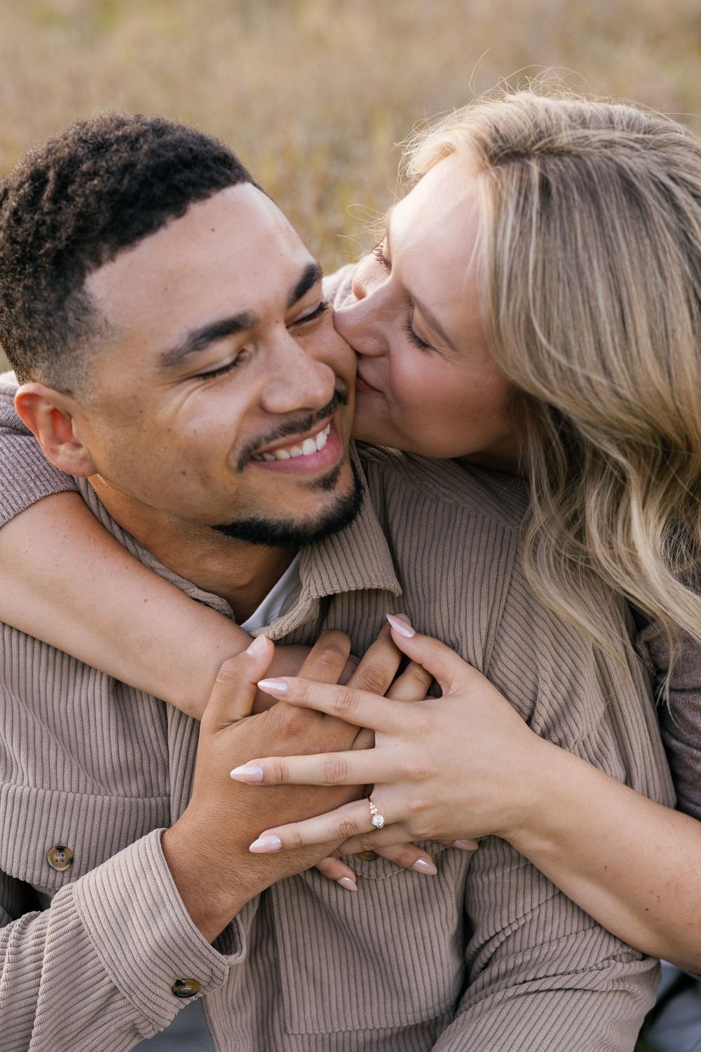 A couple shares intimate moments in a series of candid photos showing affection and laughter while wearing beige sweaters.