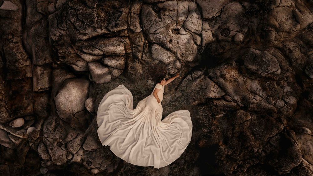 Aerial Maternity Photo. Jervis Bay. Nature Textures. pregnant women laying on rocks, submerged in the textures of Jervis Bay