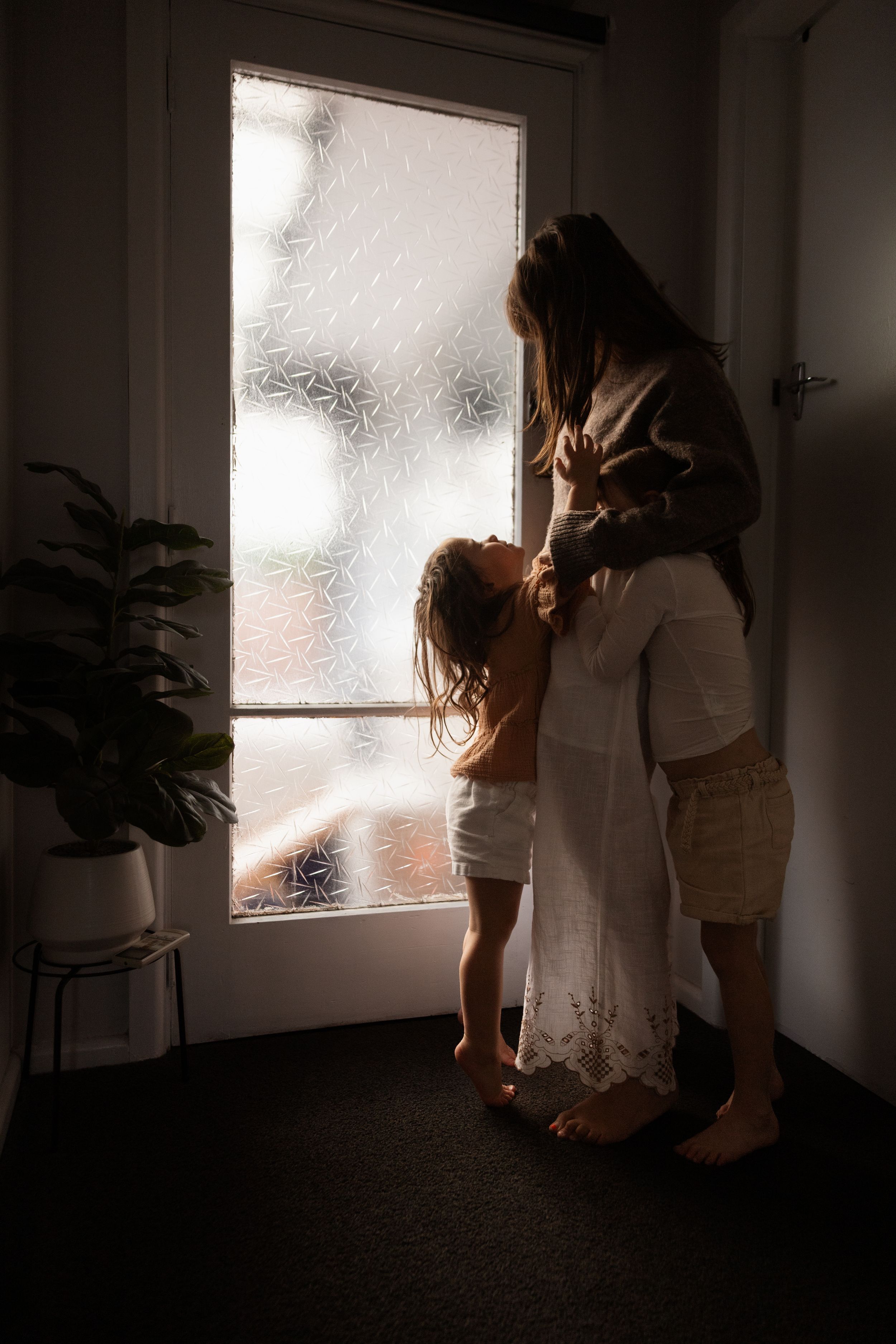 Mum capturing candid moments at home with daughters
