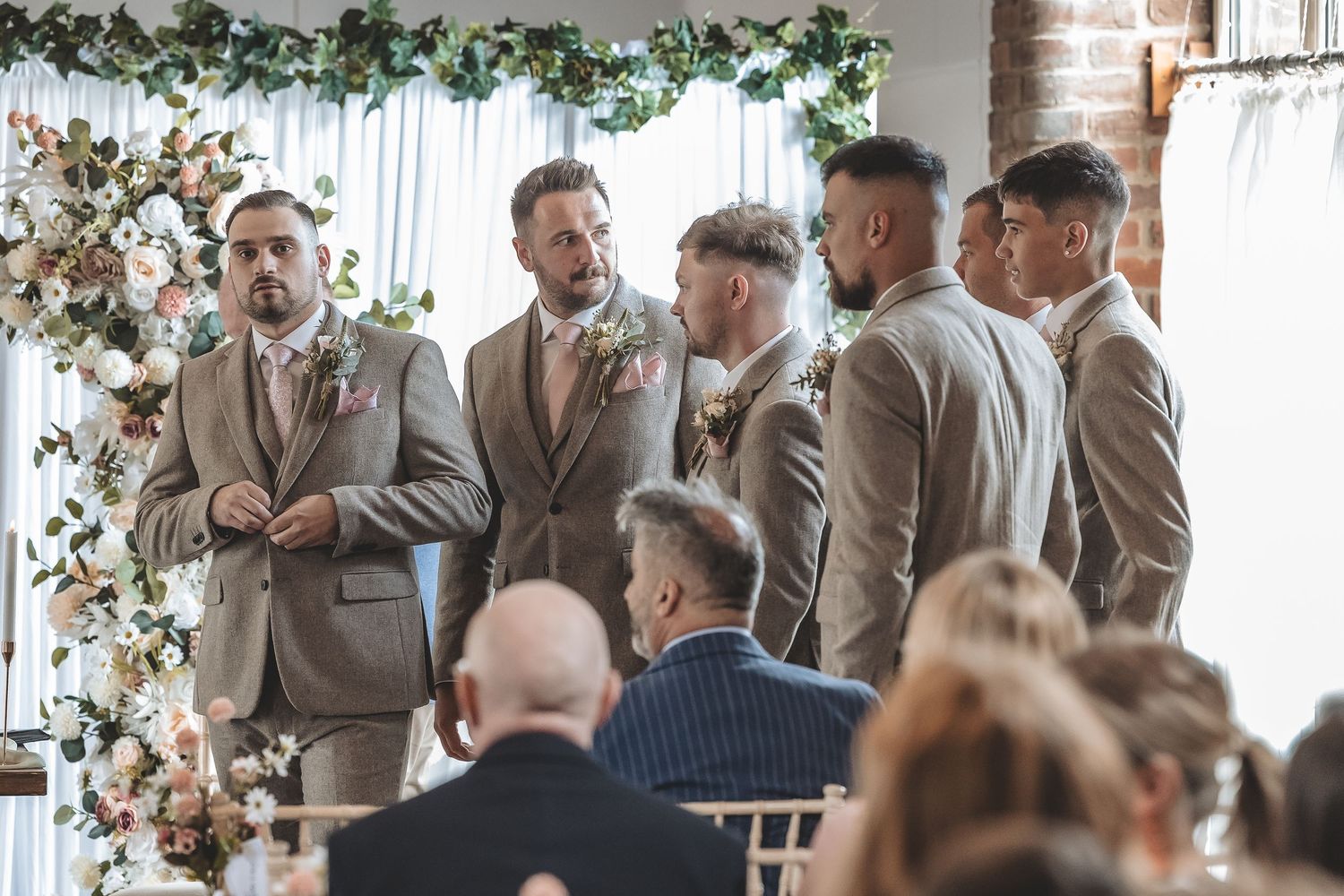The real natural anticipated moment groom awaits arrival of his bride.