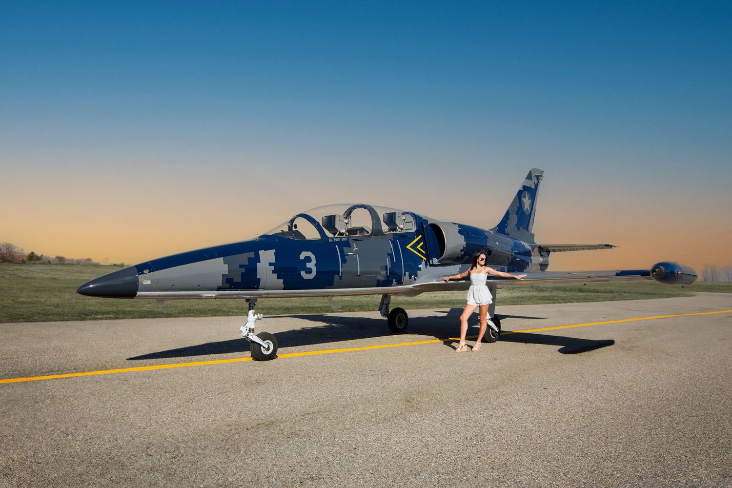 Modern editorial senior portrait with girl and jet plane in Howell Michigan; senior aviation photos by Brighton, MI photographer